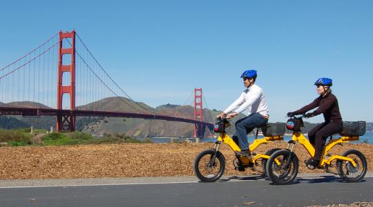 Two E-Bikers riding towards the Golden Gate Bridge