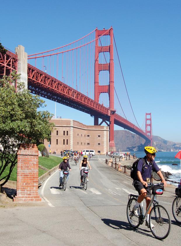 Bikers departing Historic Fort Point located under the Golden Gate Bridge